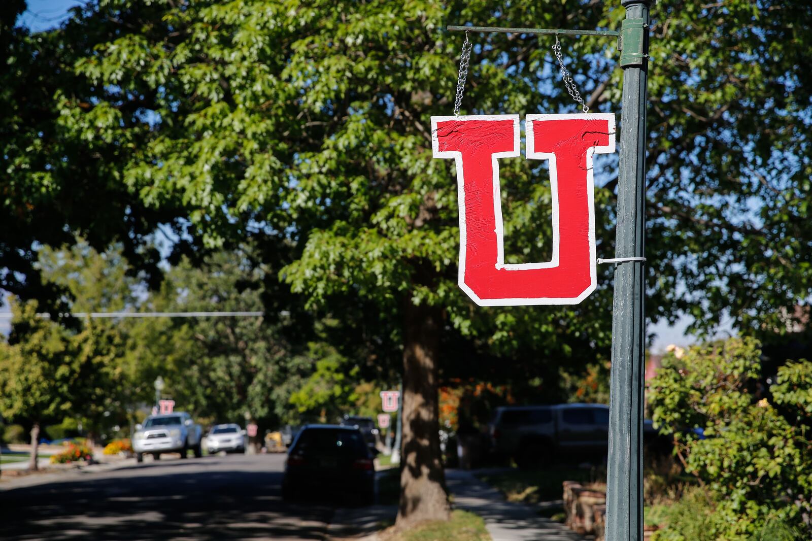 A “U” sign hangs in the Salt Lake City neighborhood near where University of Utah football player back Aaron Lowe was killed.