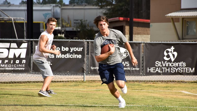 Brothers Dave (Evan Hofer) and Zach Truett (Tanner Stine) run drills in “Run the Race."