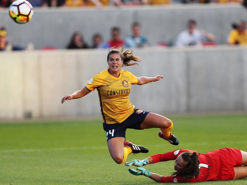 Utah Royals FC forward Katie Stengel (24) scores on Sky Blue FC goalkeeper Kailen Sheridan (1) in Sandy on Saturday, June 30, 2018.