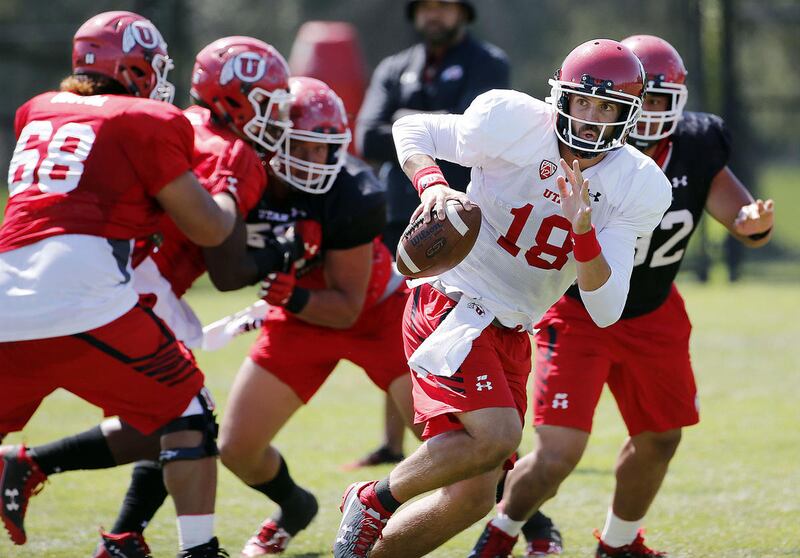 Cooper Bateman looks to pass during University of Utah football practice in Salt Lake City on Thursday, Aug. 10, 2017.
