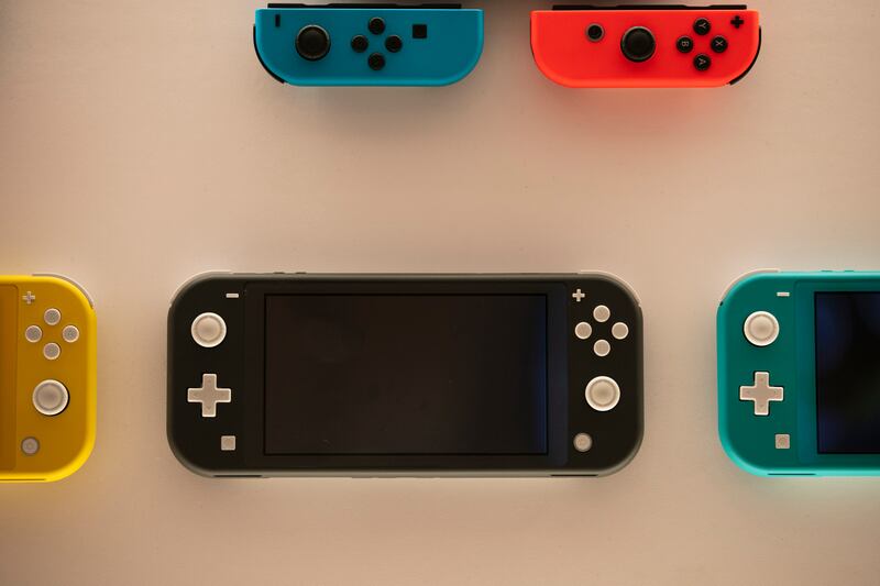 Nintendo Switch game consoles are on display at Nintendo’s official store in the Shibuya district of Tokyo, Thursday, Jan. 23, 2020