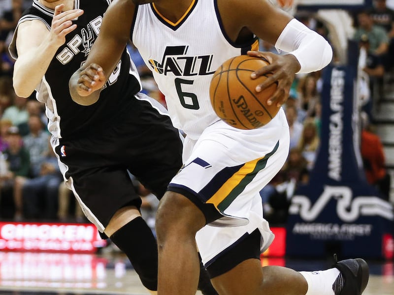 Utah Jazz forward Joe Johnson (6) drives past San Antonio Spurs forward Davis Bertans (42) during a game a Vivant Smart Home Arena in Salt Lake City on Wednesday, April 12, 2017.