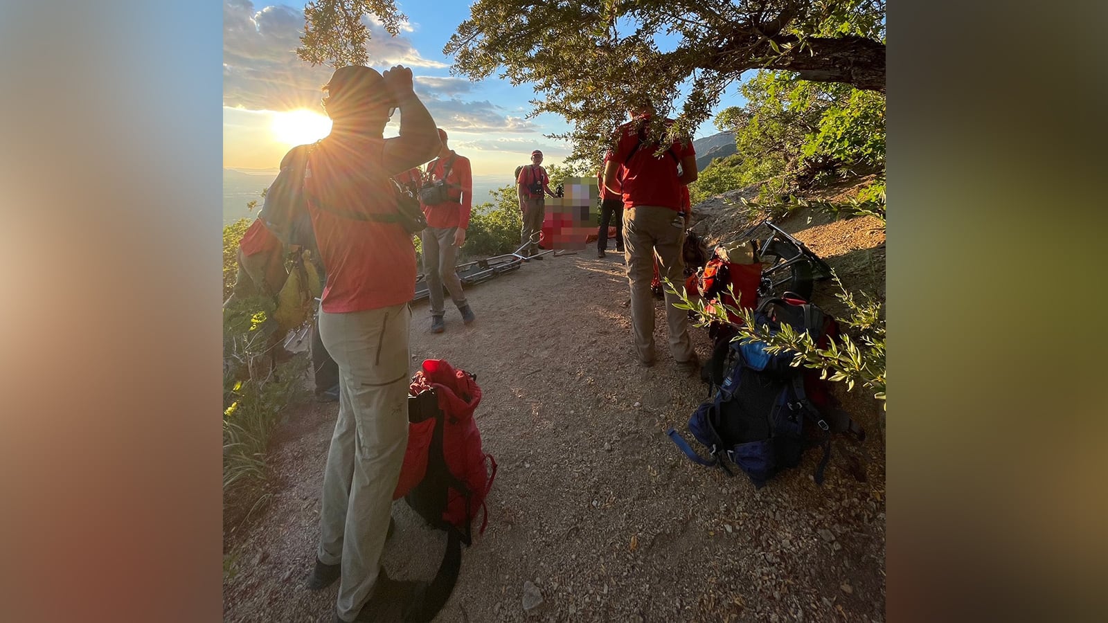 Members of the Salt Lake County Search and Rescue team help an injured hiker get down from Ferguson Canyon on Saturday.