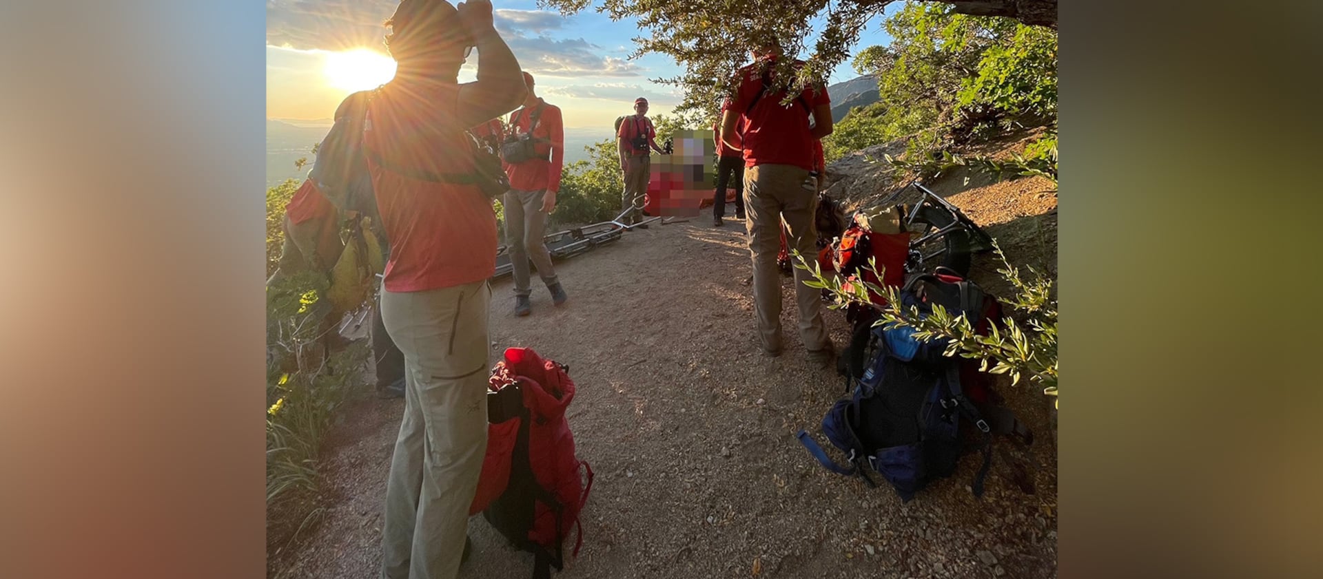 Members of the Salt Lake County Search and Rescue team help an injured hiker get down from Ferguson Canyon on Saturday.