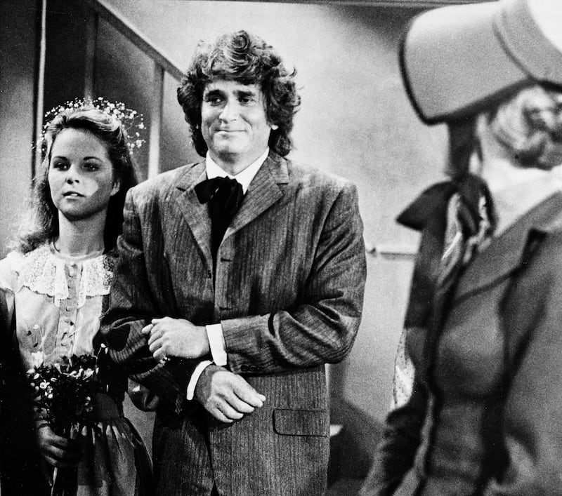 Actress Melissa Sue Anderson, left, who plays Mary for the television series “ Little House on the Prairie” is escorted by actor Michael Landon, who plays her father.