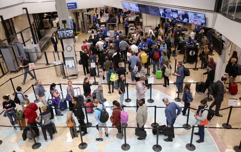 Travelers move through security at the Salt Lake City International Airport in Salt Lake City on Thursday, Oct. 5, 2017.