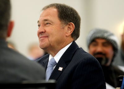 Utah's Governor Garry R. Hurbert smiles as he his introduced by Pamela Atkinson as he receives a lifetime award from the refugee community at an event at the Salt Lake City Sheraton on Friday, May 31, 2019.