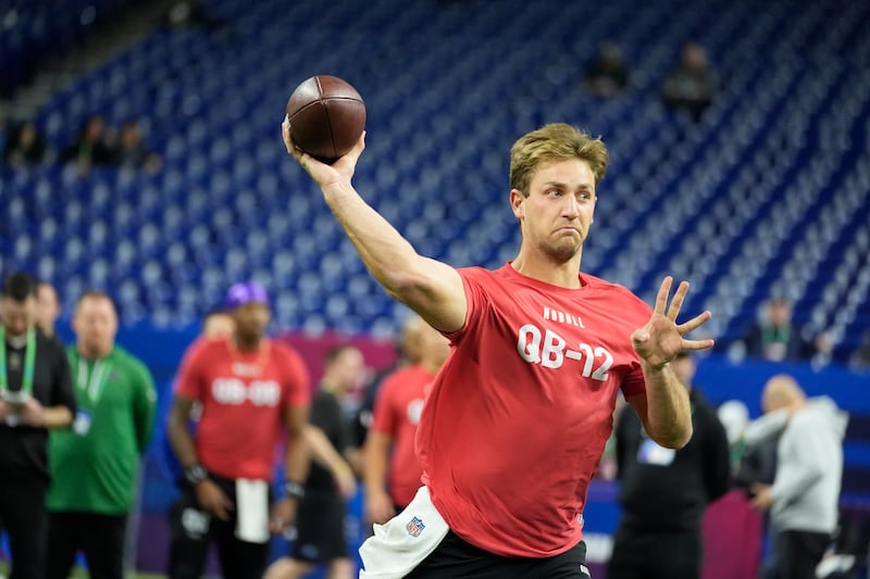 Brigham Young quarterback Kedon Slovis runs a drill at the NFL football scouting combine, Saturday, March 2, 2024, in Indianapolis. (AP Photo/Michael Conroy)