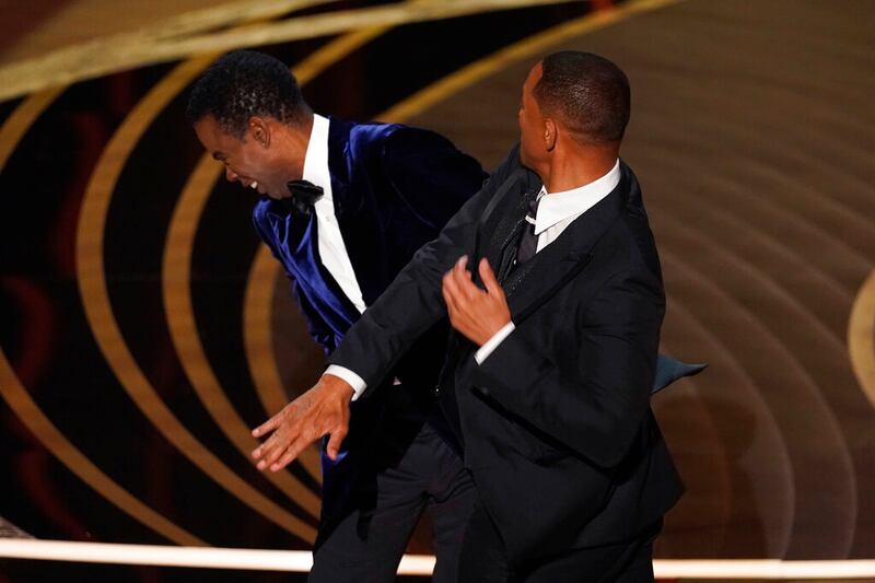 Will Smith hits presenter Chris Rock.