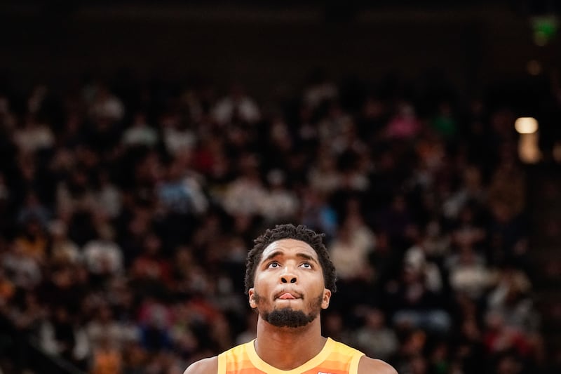 Utah Jazz guard Donovan Mitchell watches the scoreboard during game against the Minnesota Timberwolves at Vivint Arena.