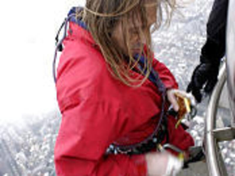 French climber Alain Robert scales the Taipei 101, the tallest building in the world, Saturday.
