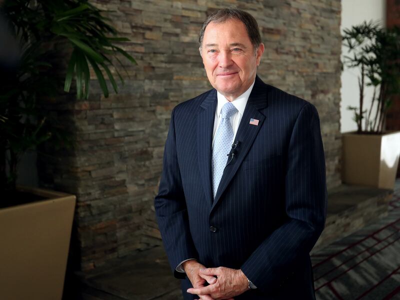 FILE - Utah Governor Garry R. Herbert prepares to talk with media members after receiving a lifetime award from the refugee community at an event at the Salt Lake City Sheraton on Friday, May 31, 2019. Nearly half of Utah voters approve of the job Herbert