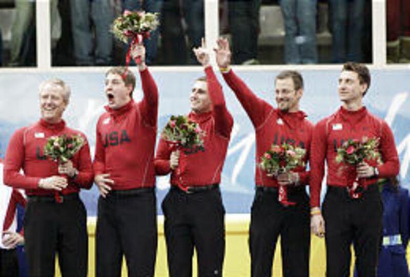U.S. curlers Scott Baird, left, John Shuster, Joe Polo, Shawn Rojeski and Pete Fenson receive the bronze medal.