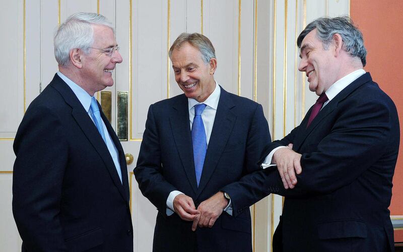 Former British Prime Ministers Sir John Major, left, Tony Blair, centre, and Gordon Brown chat before posing for a photograph with the Queen and Prime Minister David Cameron, ahead of a Diamond Jubilee lunch hosted by Cameron at 10 Downing Street, Londo