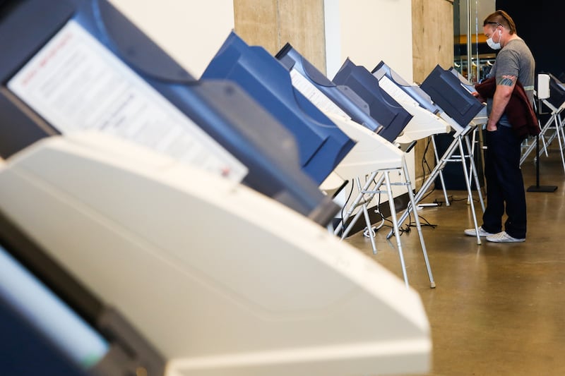 A voter fills in a ballot during Election Day voting at Vivint Arena in Salt Lake City on Nov. 3, 2020.