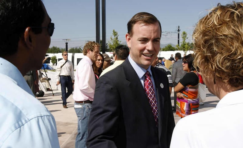 Mayor Mike Winder of West Valley City greets people during ceremonies for the new Mid-Jordan and West Valley TRAX lines, Tuesday, Aug. 2, 2011.