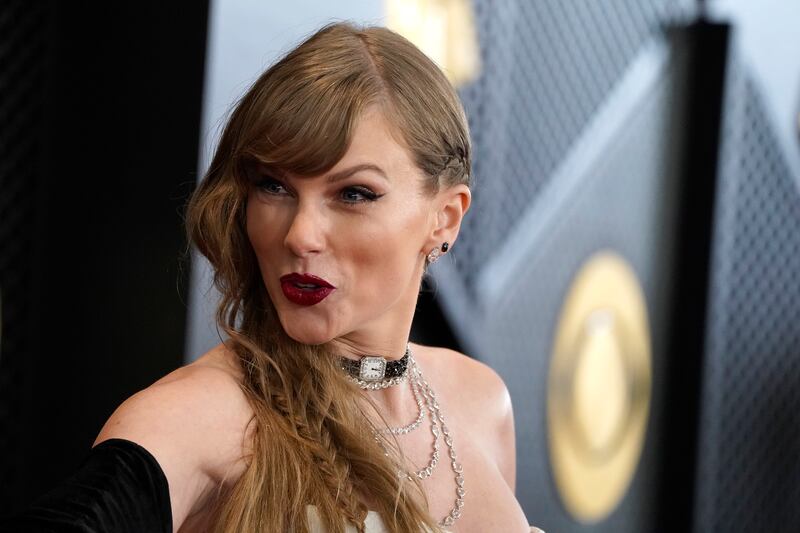Taylor Swift arrives at the 66th annual Grammy Awards on Sunday, Feb. 4, 2024.