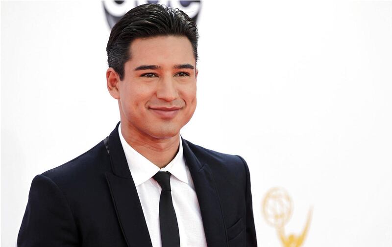 In this Sept. 23, 2012 file photo, Mario Lopez arrives at the 64th Primetime Emmy Awards at the Nokia Theatre, in Los Angeles. Lopez, along with other “Saved by the Bell” alums will be starring in the reboot of the series on NBC’s Peacock.
