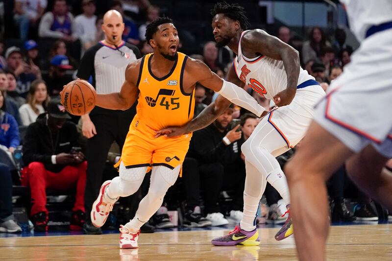 Utah Jazz’s Donovan Mitchell, left, during the second half of an NBA basketball game against the New York Knicks.