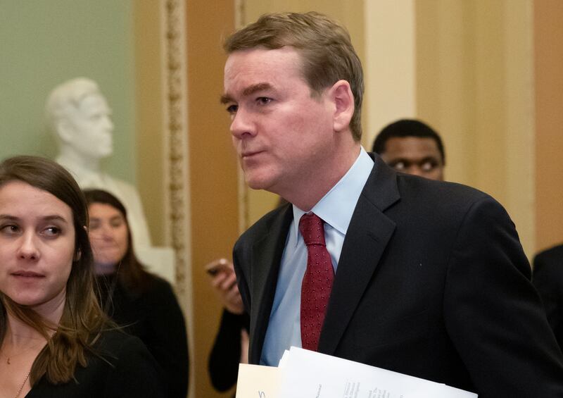In this Jan. 24, 2019, file photo, Sen. Michael Bennet, D-Colo., leaves the chamber at the Capitol in Washington. Bennet says he has been diagnosed with prostate cancer as he considers a 2020 Democratic presidential bid.