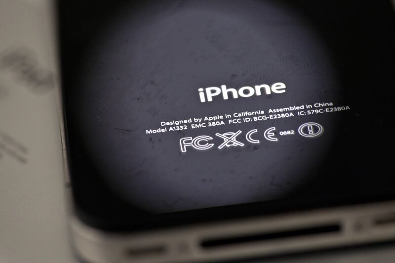 FILE- In this Thursday, Dec. 6, 2012, photo, the back of an iPhone 4 in New York. Apple is apologizing for secretly slowing down older iPhones, which it says was necessary to avoid unexpected shutdowns related to battery fatigue. The company issued the st