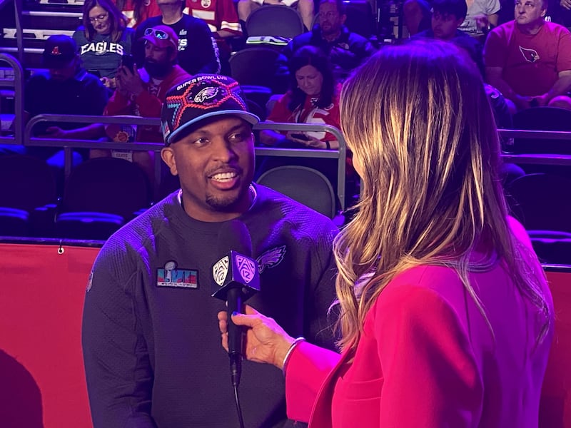 Philadelphia Eagles quarterbacks coach Brian Johnson talks with a reporter during Super Bowl 57 Opening Night at Footprint Center in Phoenix on Monday, Feb. 6, 2023.