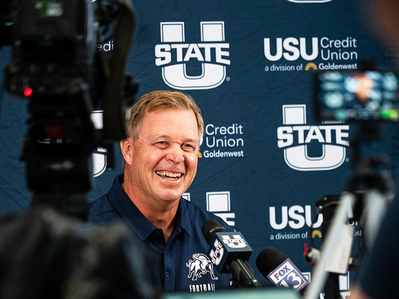 Utah State head coach Bronco Mendenhall grins during Aggie media day in Logan, Utah, Tuesday, Aug. 4, 2026.