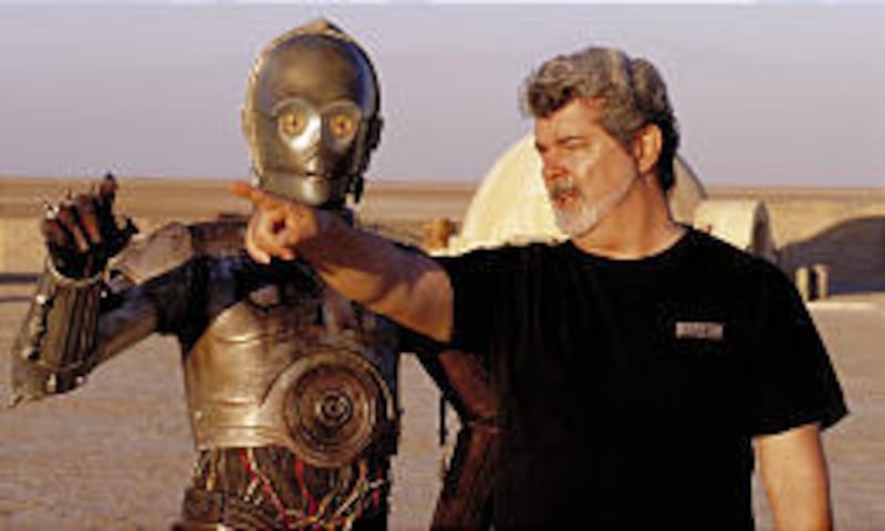 On location in Tunisia, George Lucas with Anthony Daniels, as the robot C-3PO, in “Attack of the Clones.”