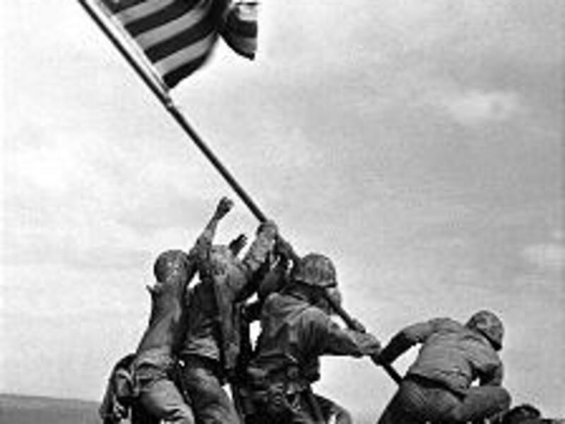 Marines raise the American flag atop Mount Suribachi in the famous World War II photo.