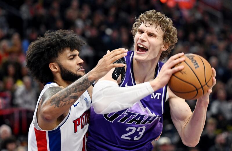 Utah Jazz forward Lauri Markkanen battles Detroit Pistons forward Isaiah Livers at the Delta Center in Salt Lake City.