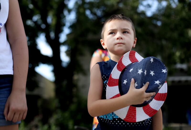 Tayson Dale, 6, stands as the Mormon Battalion color guard passes by during the 2019 Days of ’47 Parade in Salt Lake City.