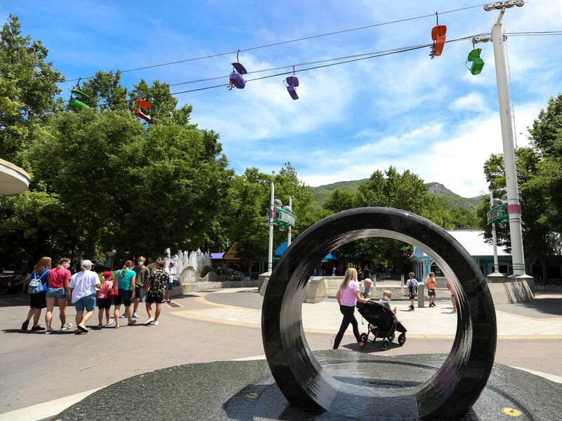 Guests wear face coverings as they walk through Lagoon in Farmington on Monday, June 15, 2020. Working with the Davis County Health Department, Lagoon has adopted a new safety protocol for guests in the park.