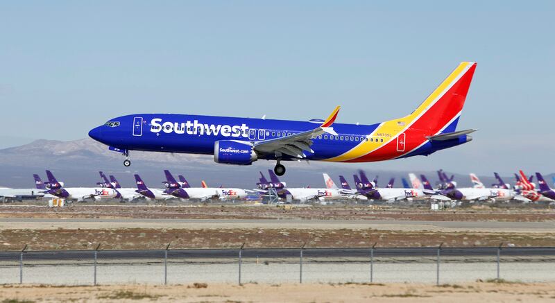 In this March 23, 2019, file photo, a Southwest Airlines Boeing 737 Max aircraft lands at the Southern California Logistics Airport in the high desert town of Victorville, Calif.