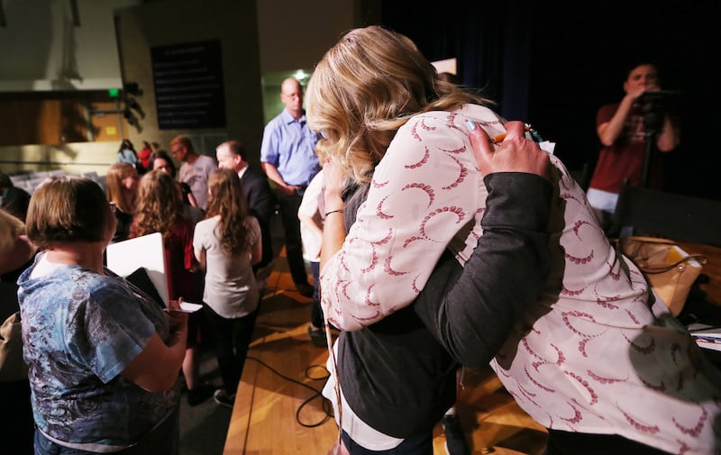 "Angst" producer Karin Gornick hugs Ginger Hales after a screening of the movie at Fort Herriman Middle School on Wednesday, May 30, 2018.