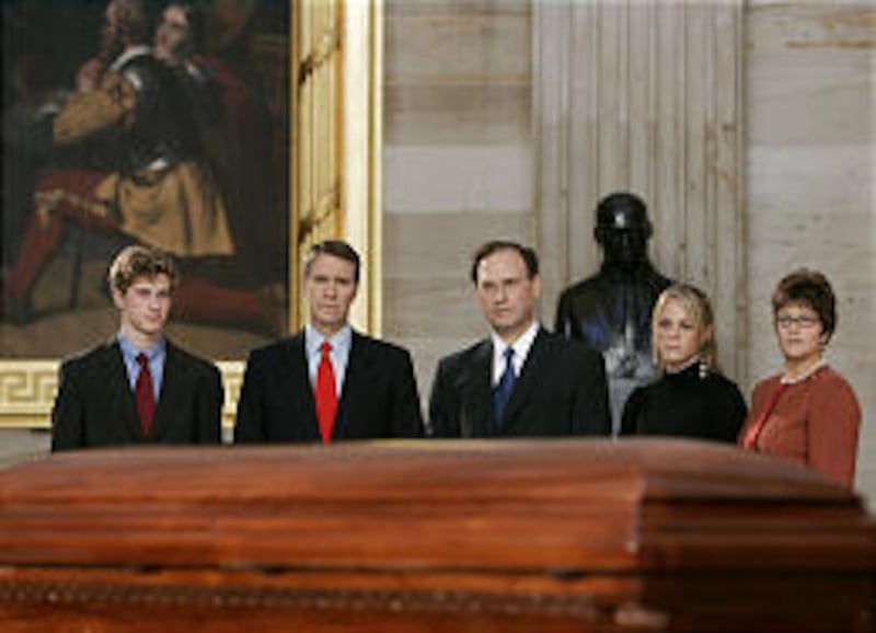 Samuel Alito, center, pays his respects Monday to Rosa Parks in the Capitol Rotunda, accompanied, from left, by son Philip, Sen. Bill Frist, daughter Laura and his wife, Martha.