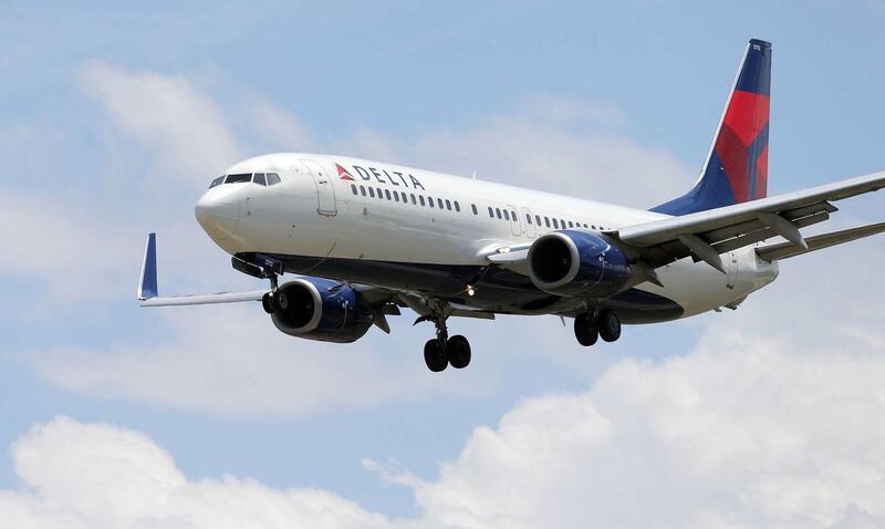 A Delta plane makes it's final approach Monday, May 19, 2014 at the Salt Lake City International Airport. Delta Air Lines will launch daily nonstop services from Amsterdam Airport Schiphol to Salt Lake City International Airport in May 2015.