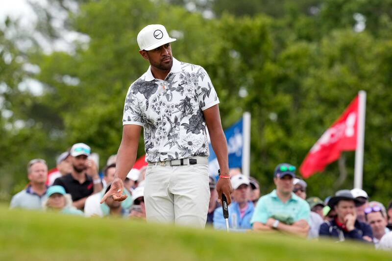 Tony Finau reacts to putt on the seventh hole during the first round of the U.S. Open at The Country Club in Brookline, Mass.