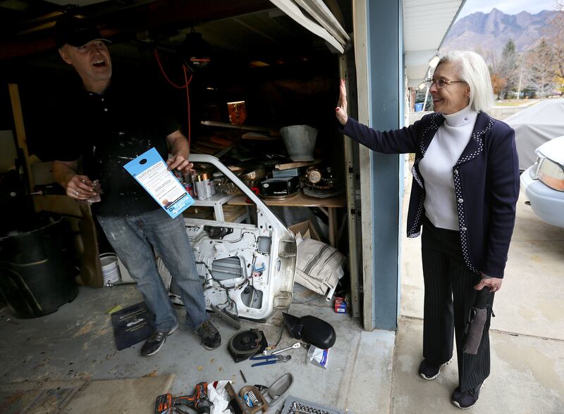 Casey Packard talks to Dr. Kathie Allen, Democratic candidate for the vacant seat in the 3rd Congressional District, as Allen campaigns in Holladay on Friday, Nov. 3, 2017.