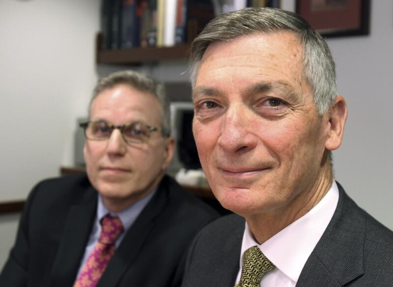 This Friday, Feb. 6, 2015 photo shows stroke survivor Don Sadoway, foreground, and Lee Schwamm, vice chairman of the Massachusetts General Hospital's neurology department, in Boston. When medicine failed to dissolve a clot in Sadoway's brain, his wife agr