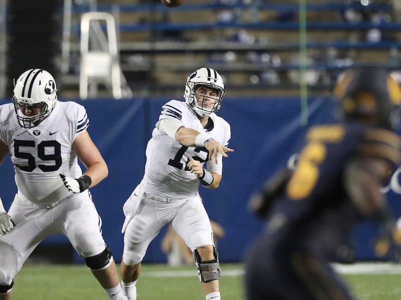 Brigham Young Cougars quarterback Tanner Mangum (12) throws against the California Golden Bears in Provo on Saturday, Sept. 8, 2018.