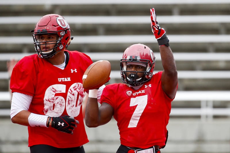 Devonta’e Henry-Cole celebrates a touchdown with Keven Dixon during a scrimmage at Rice-Eccles Stadium in Salt Lake City on Tuesday, April 11, 2017. Henry-Cole entered the transfer portal in January and signed with rival BYU in February. He spoke publicly to the Deseret News for the first time about his decision to transfer to BYU.