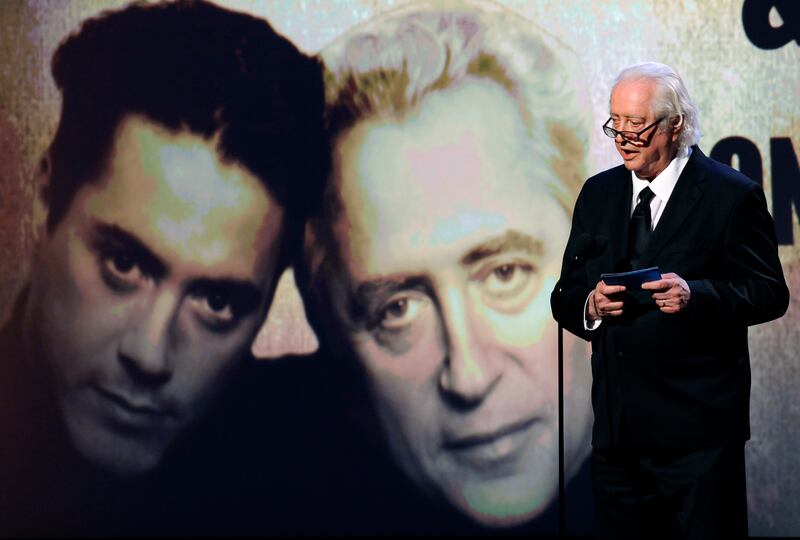 Actor and filmmaker Robert Downey Sr. addresses the audience with his son, actor Robert Downey Jr.