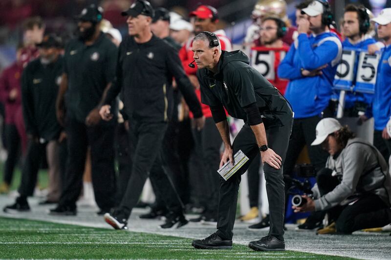 Florida State coach Mike Norvell watches during the second half of the team’s Atlantic Coast Conference championship NCAA college football game against Louisville, Saturday, Dec. 2, 2023, in Charlotte, N.C.