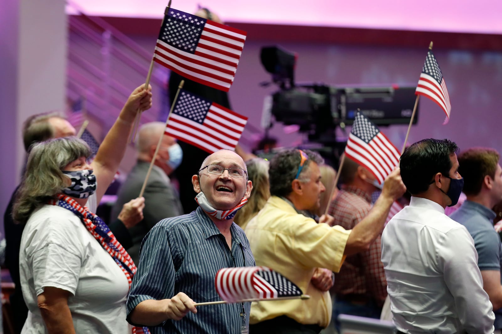 Attendees wave flags before then-Vice President Mike Pence spoke at First Baptist Church Dallas in June 2020.