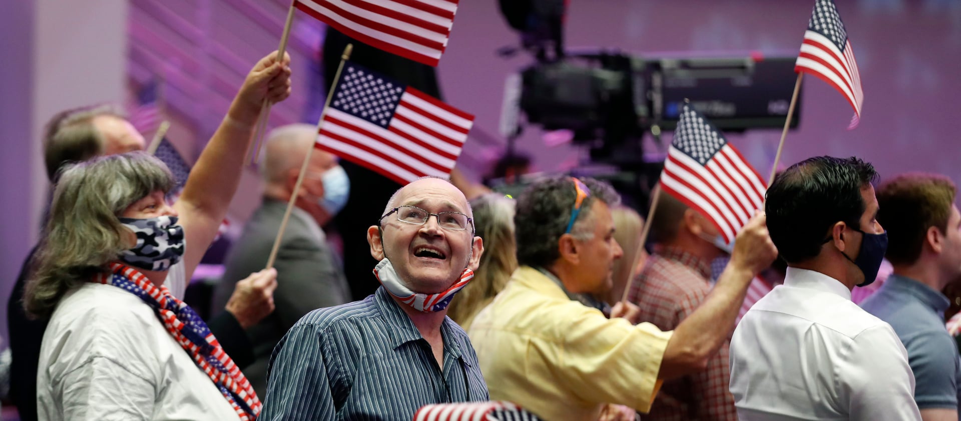 Attendees wave flags before then-Vice President Mike Pence spoke at First Baptist Church Dallas in June 2020.