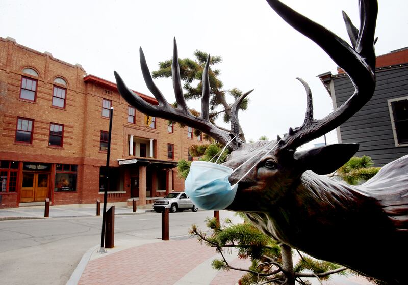 A masked deer looks out on a very slow Main Street in Park City on April 27, 2020.