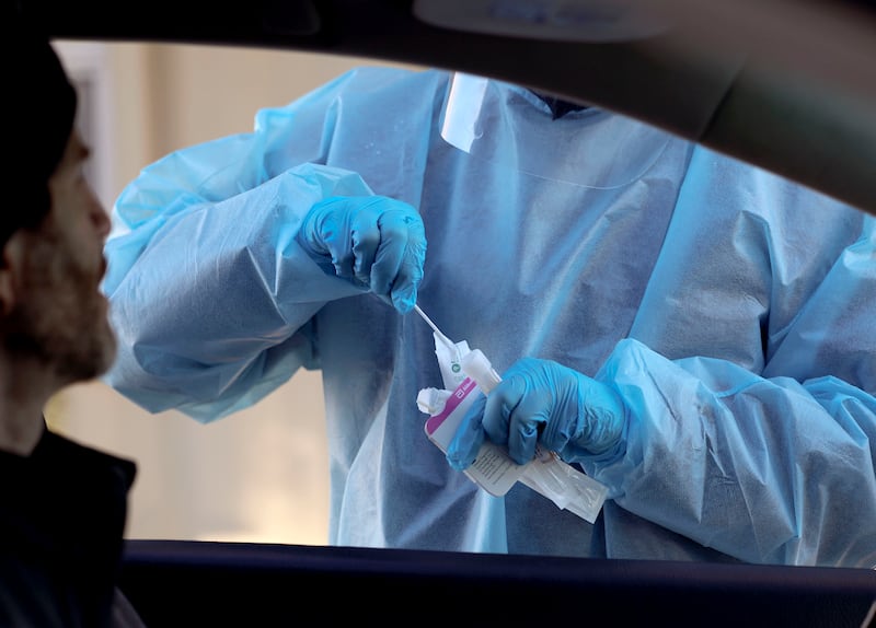 Corey Lewis waits to receive a COVID-19 test.