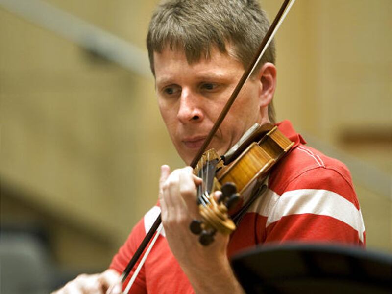 David Porter, a musician from the Intermezzo concert series, rehearses in the Vieve Gore Concert Hall Tuesday.