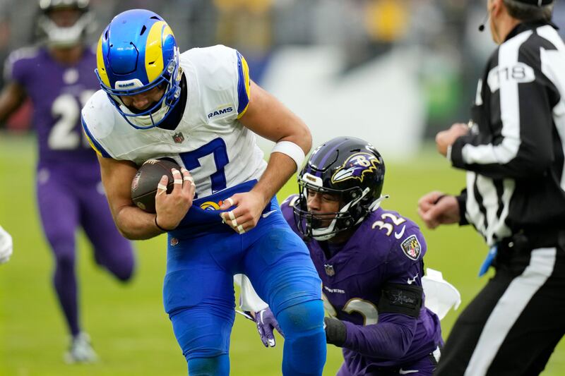 Los Angeles Rams wide receiver Puka Nacua, left, runs with the ball as Baltimore Ravens safety Marcus Williams (32) attempts a tackle on Dec. 10, 2023, in Baltimore.