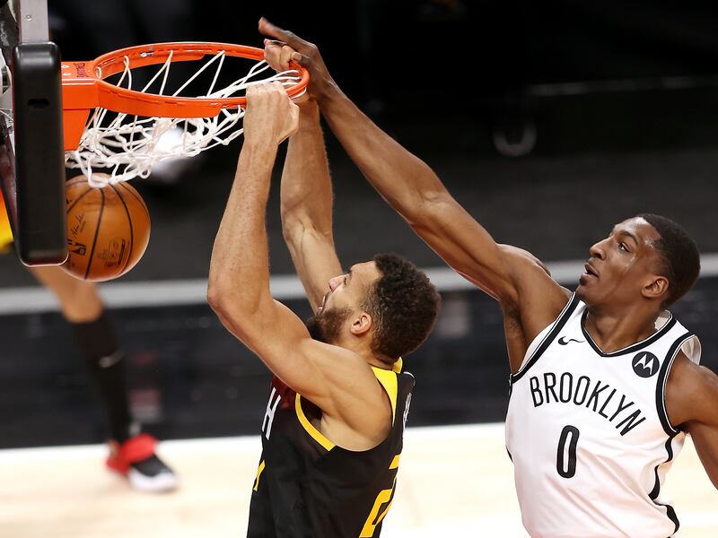Utah Jazz center Rudy Gobert (27) dunks with Brooklyn Nets forward Reggie Perry (0) defending.